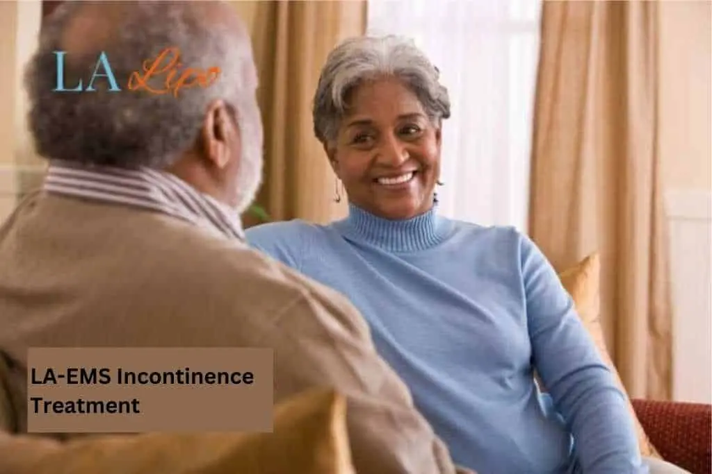 Couple sat smiling at each other - LA-EMS treatment Cricklewood
